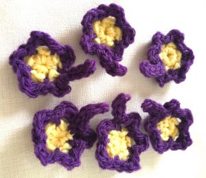 Little purple and lemon crochet flowers