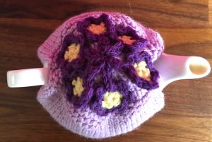 Tea cosy with little purple and yellow flowers