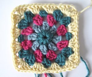 Fifth round of floral granny square