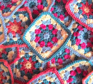 Pile of floral granny squares