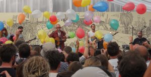Diagrams playing at End of the Road Festival with balloons
