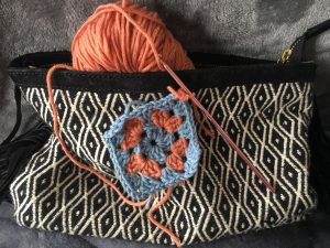 Bag with yarn inside and granny square