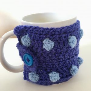 Blue spotted crocheted mug warmer
