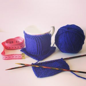 Mug cozy and matching knitted coaster